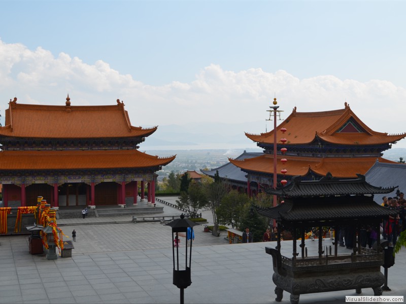 Incense burners in front of a temple.