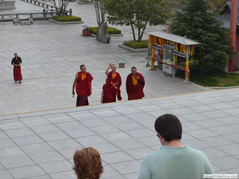 One of the monks ways a peace sign to us.