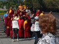 A group of visiting monks pose for pictures.
