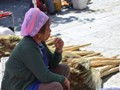 This woman was selling brooms.<br/>