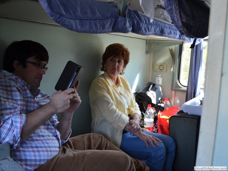 Brad and Claudette relaxing in our train compartment.