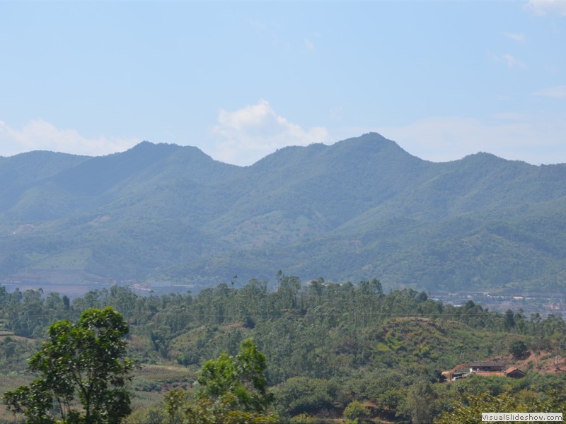 Mountains along the way on both sides of the train.