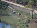 Some of the local people taking time to fish in a river.