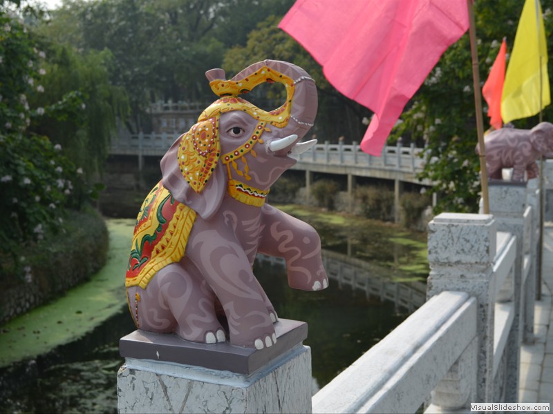 Decorations on the fench posts in the park.