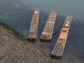 The local boat are bamboo logs tied together.