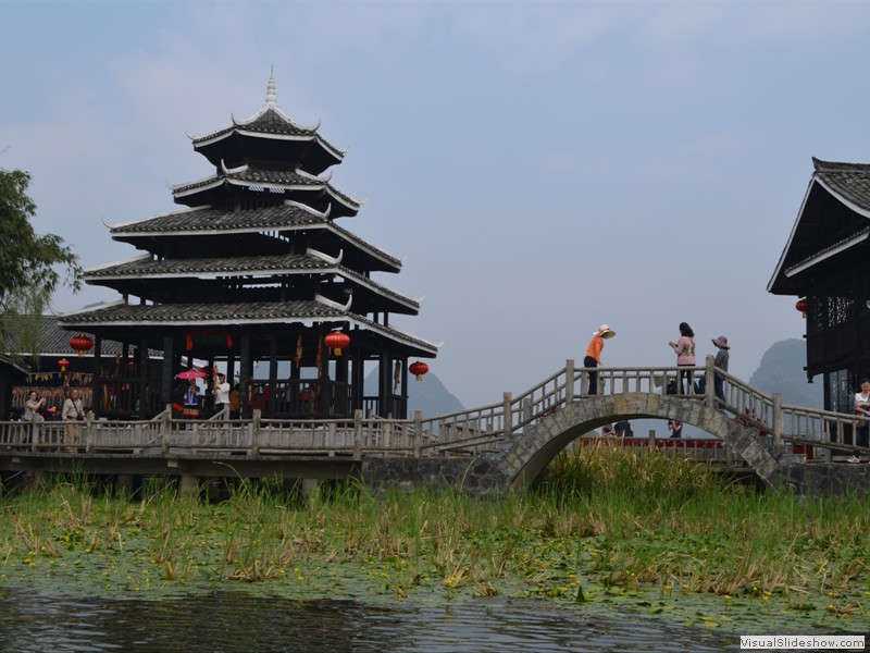 A pretty little pagoda next to the river. 