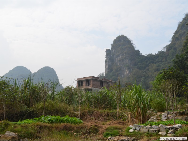 A house under construction near the river.