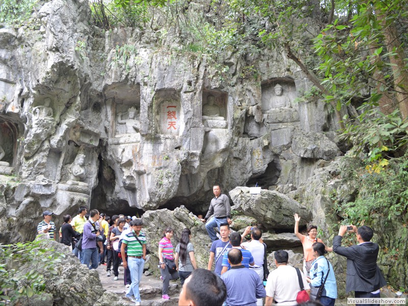 The grottoes are cut into the side of the mountain.