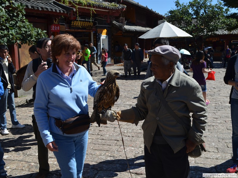 Claudette petting the hawk.