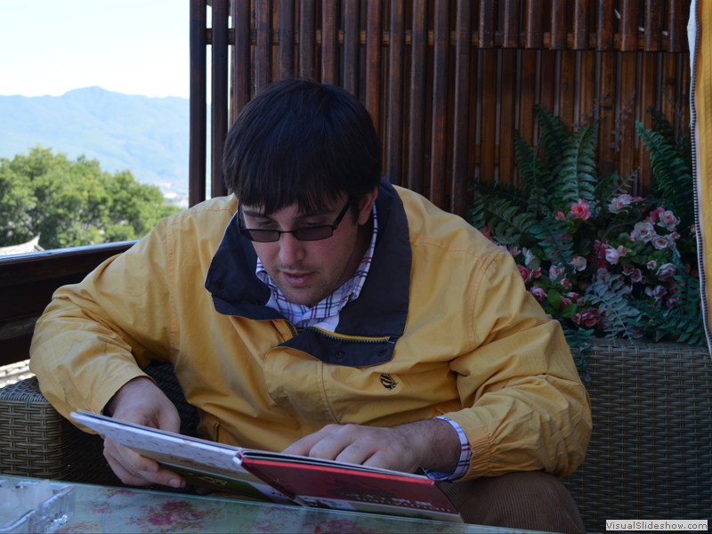 Brad looking over a menu.