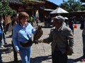 Claudette petting the hawk.