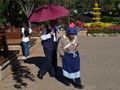 People use umbrella's to stay out of the bright sun.