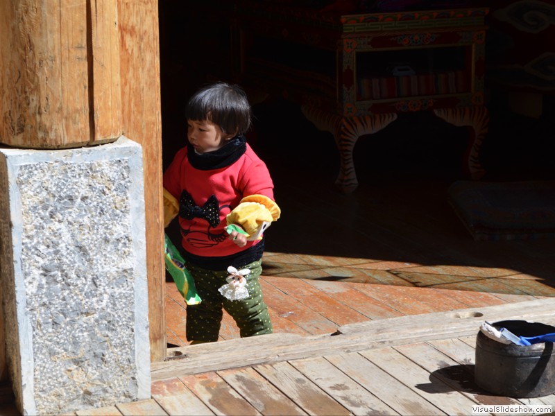 A cute little girl in the market place.