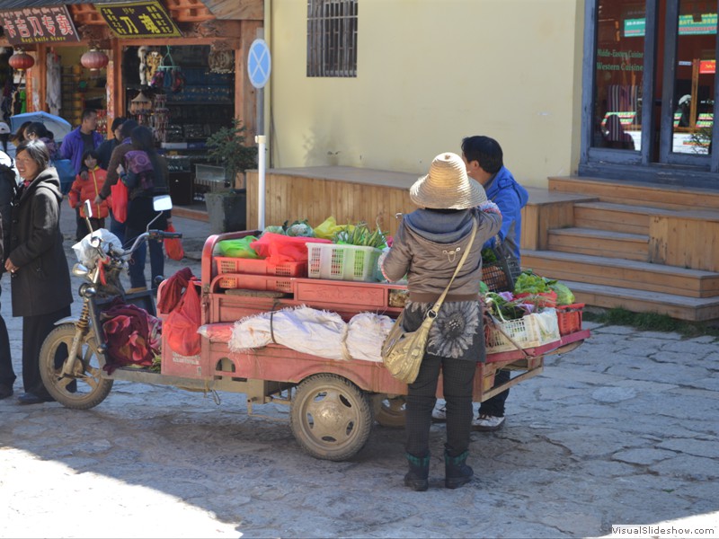 A street vendor selling vegetables.