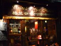 The "United Coffee House" written in Chinese and Tibetian on the sign.