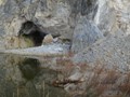 A small cave next to the lake.  Notice the Yak carcass by the water edge.
