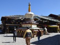 Note the prayer wheels along the sides of the monument.