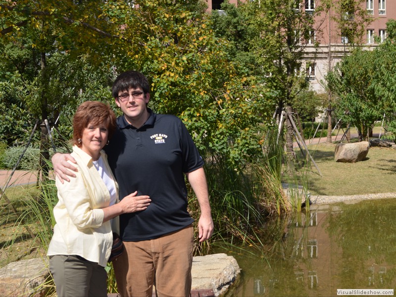 Claudette and Brad in the apartment courtyard.