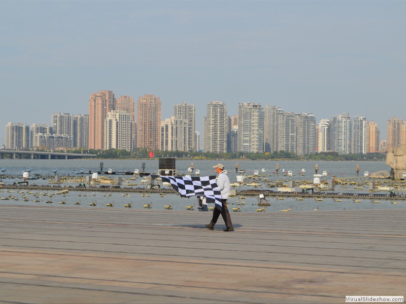 Getting ready to fly a kite by the lake in Suzhou.